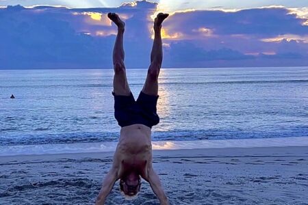 Sunrise Handstand At The Beach